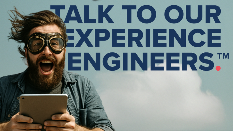 excited man with long hair and a beard wearing goggles holding an iPad